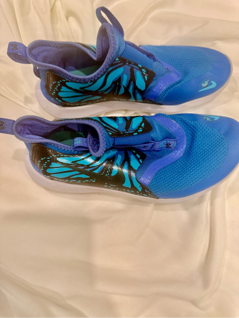 Nike Kids Blue Slip-On Sneakers with Teal and Black Accent